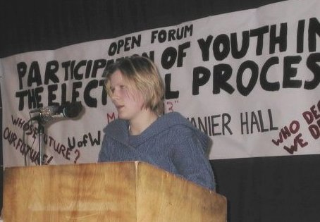 Laura Chesnik speaks at podium of Windsor Youth Conference 2004