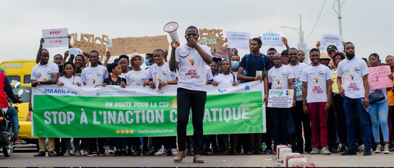 Demonstrators at Climate Strike hold signs demanding climate justice Democratic Republic of the Congo