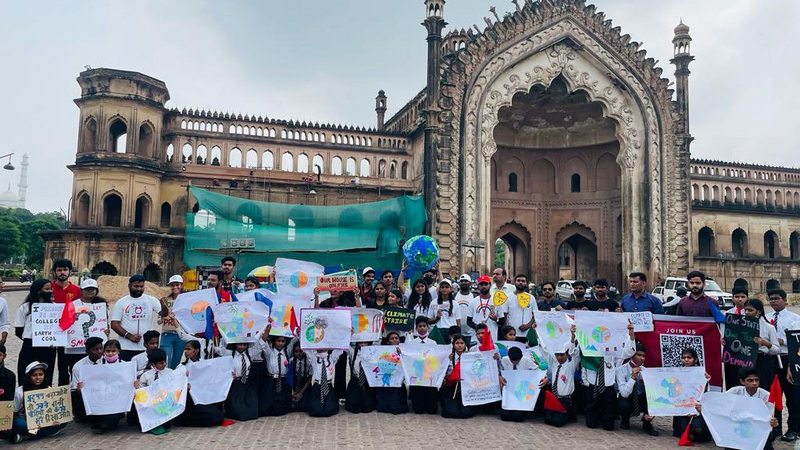 Demonstrators at Climate Strike hold signs demanding climate justice Lucknow India